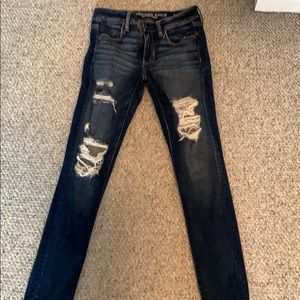 American Eagle dark wash ripped mid-rise jeggings